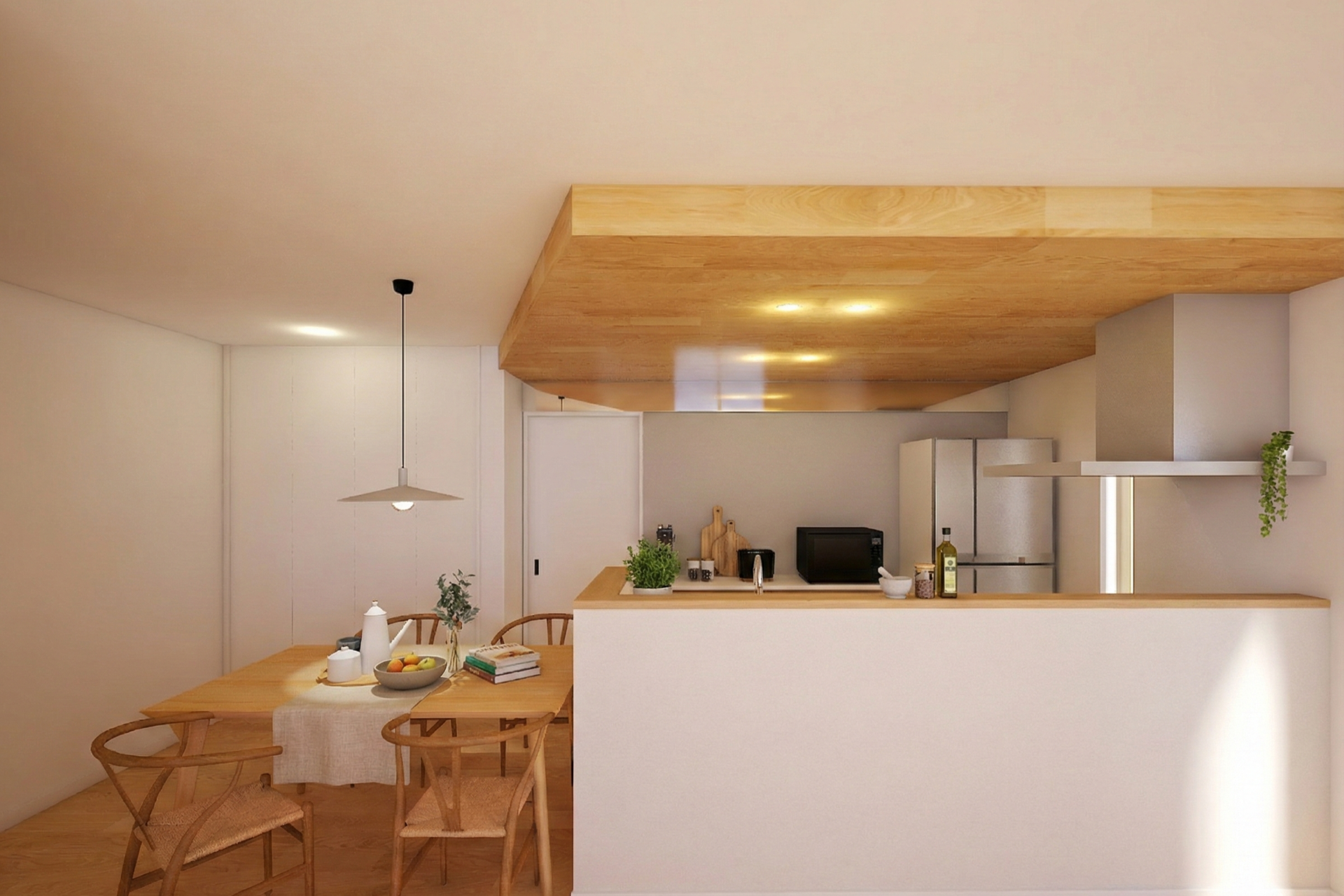 ダイニングキッチン。キッチン背面の天井にはミラーを設置し、天井が続いているかのような演出で開放感を演出。下がり天井がインテリアになります。