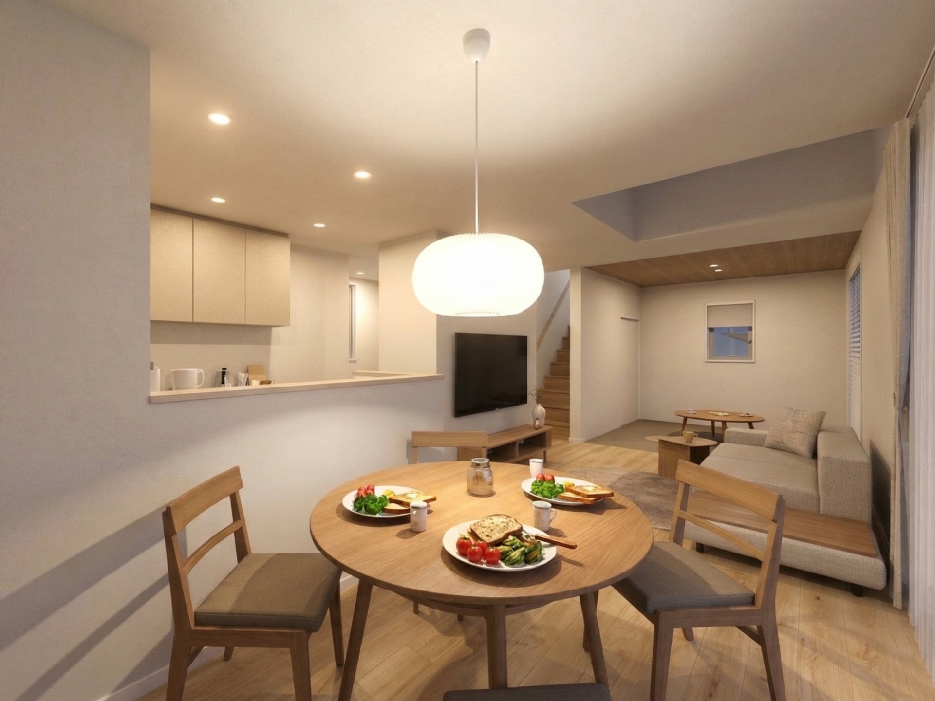キッチン、ダイニング、リビングが緩やかにつながり、どこにいても家族の気配を感じられるます