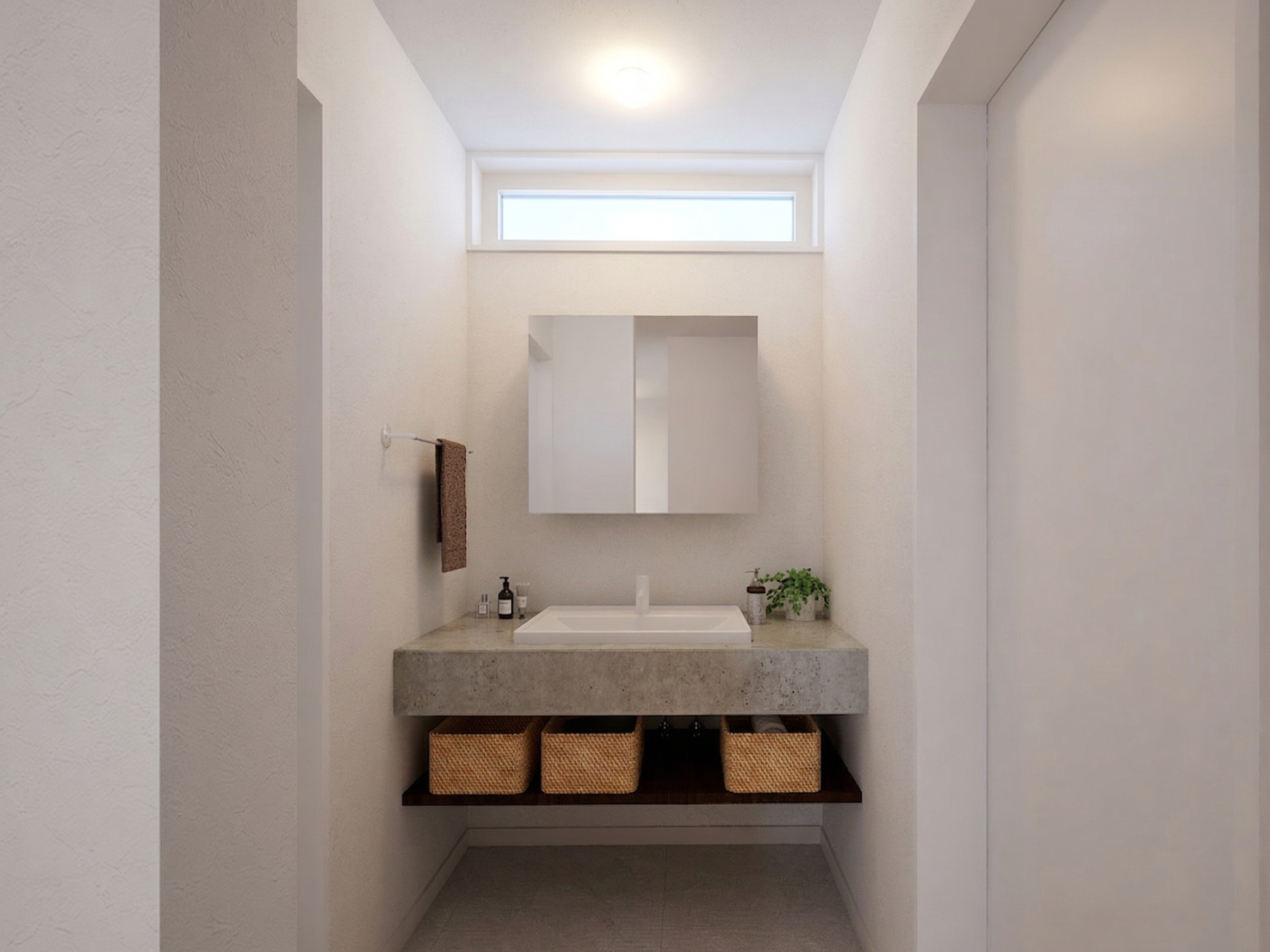 足元のオープン収納にはバスケットを並べて、見た目も美しく